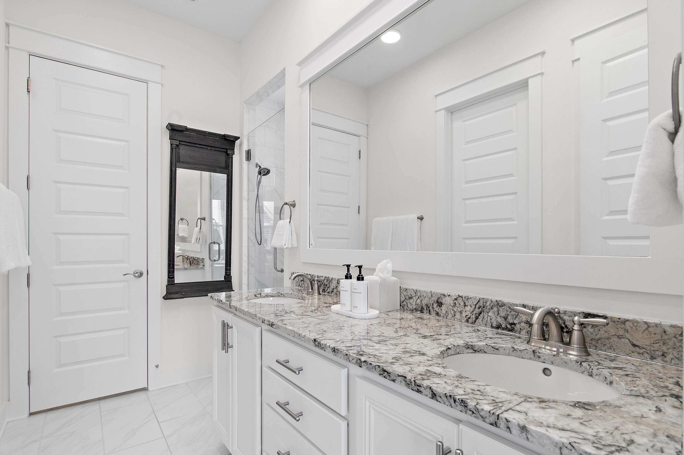 Primary bathroom with marble counters