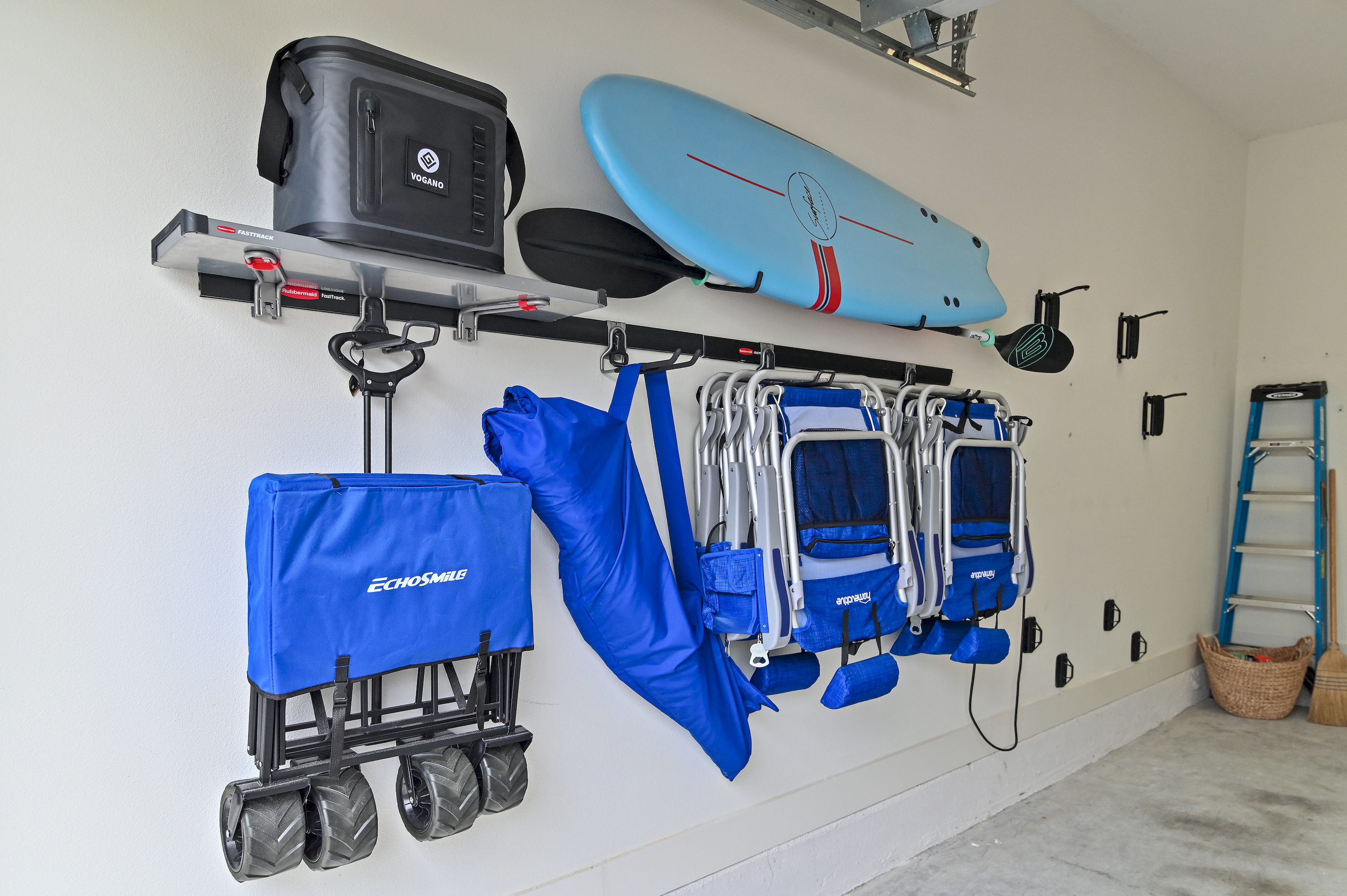Garage with paddleboard and beach gear